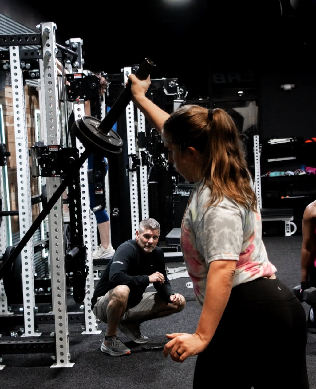 Trainer coaching landmine strength training in Mount Juliet